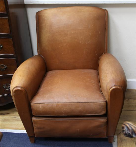 A pair of vintage leather club armchairs